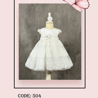 An ivory dress with lace detailing and a butterfly graphic on a mannequin.