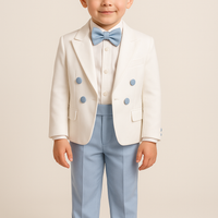 A young boy wearing a white frak jacket with blue pants, a white shirt, and a blue bow tie.