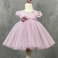 A pink A-line silhouette dress with a V-neckline, short sleeves, and a flowy skirt, displayed on a mannequin.
